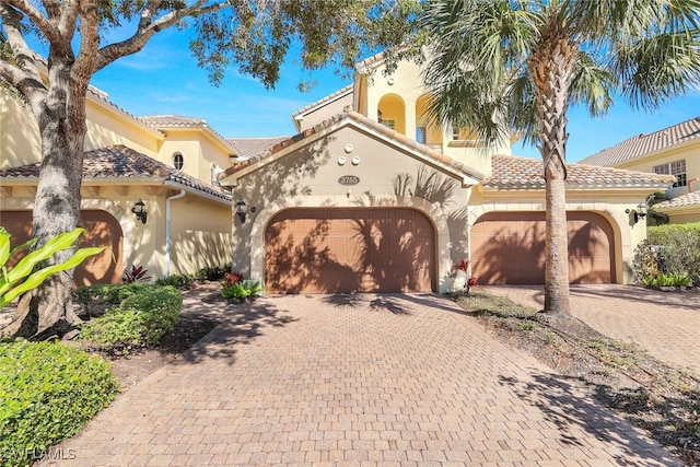 mediterranean / spanish-style house featuring a garage