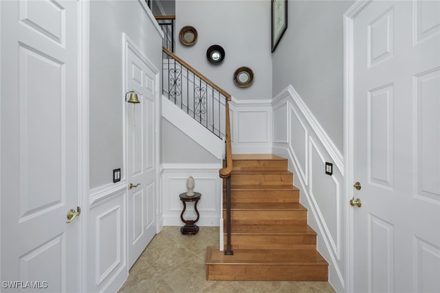 stairway featuring tile patterned floors