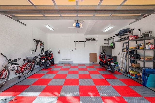 garage featuring a garage door opener