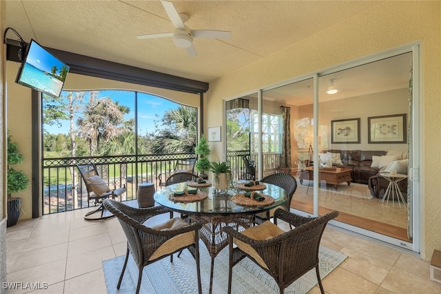 sunroom / solarium with ceiling fan