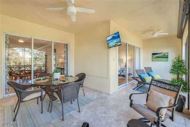 view of patio featuring ceiling fan