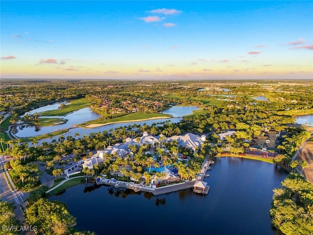 aerial view at dusk with a water view