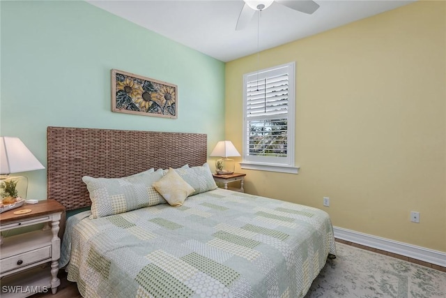 bedroom featuring ceiling fan and hardwood / wood-style floors