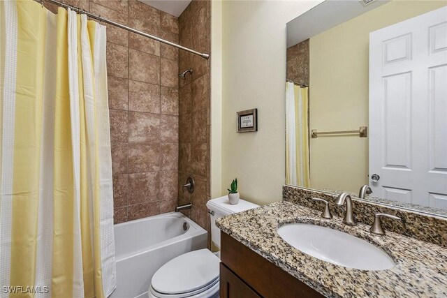 full bathroom with vanity, toilet, and shower / bath combo with shower curtain