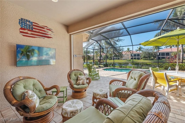 view of patio / terrace featuring a lanai