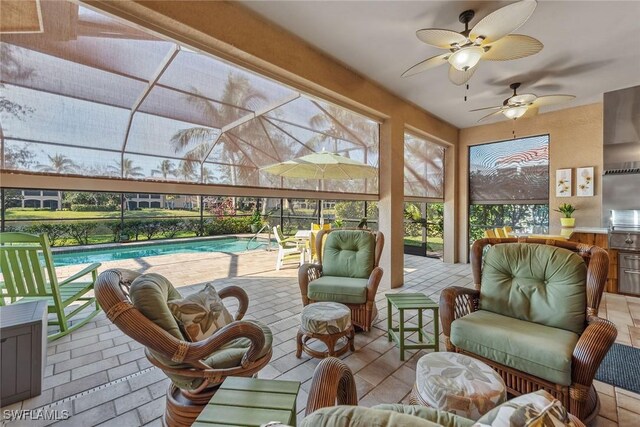 sunroom / solarium featuring a pool