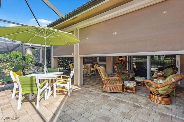 view of patio / terrace with a lanai