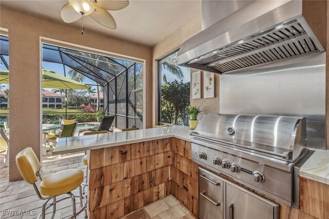 view of patio featuring a lanai and area for grilling