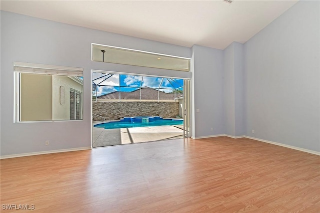 spare room with light wood-type flooring