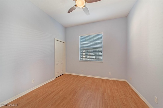 spare room featuring ceiling fan and light wood-type flooring