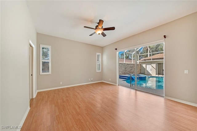 spare room featuring ceiling fan and light wood-type flooring