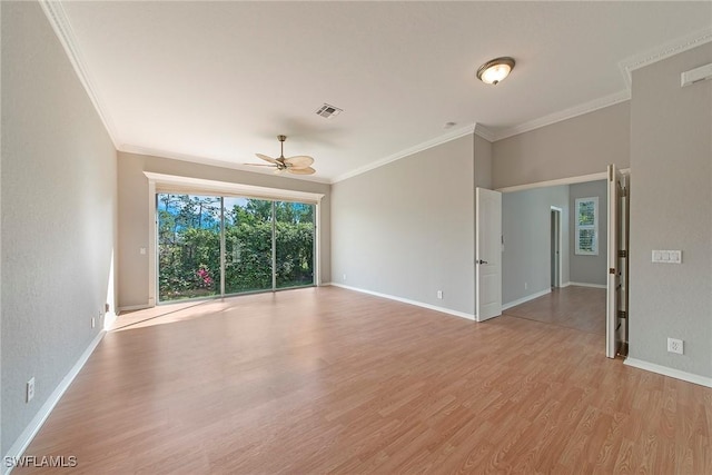 empty room featuring crown molding, ceiling fan, and light wood-type flooring