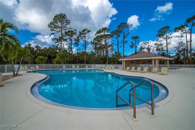 view of pool featuring a gazebo and a patio area