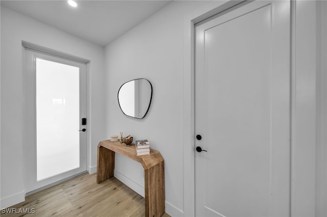 entryway with light hardwood / wood-style floors