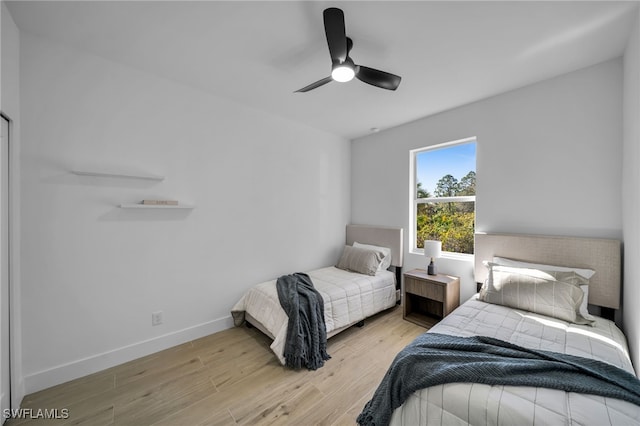 bedroom featuring ceiling fan and light hardwood / wood-style flooring