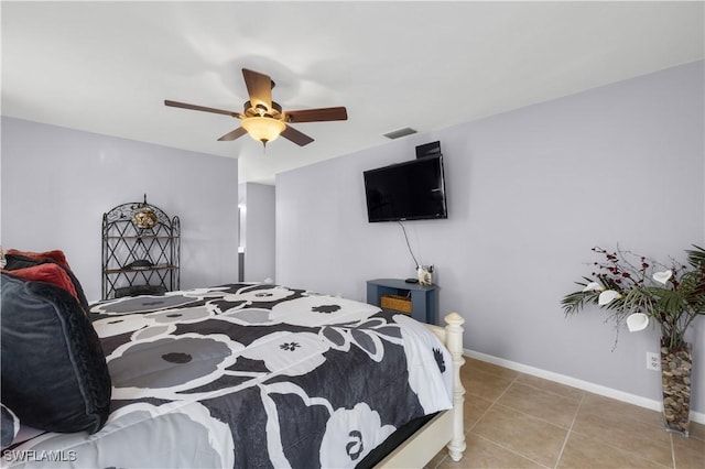 bedroom featuring light tile patterned floors and ceiling fan