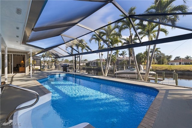 view of pool featuring a water view, a lanai, and a patio