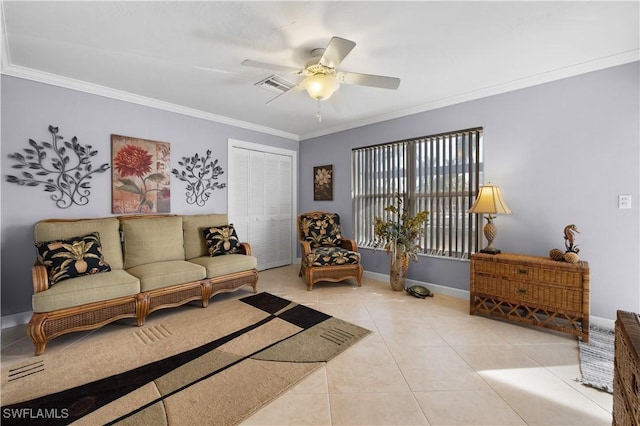 tiled living room with ornamental molding and ceiling fan