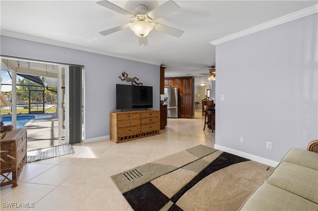 tiled living room featuring ornamental molding and ceiling fan