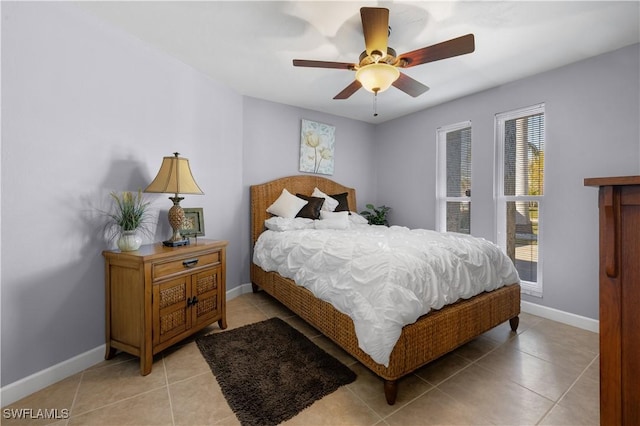 tiled bedroom with ceiling fan