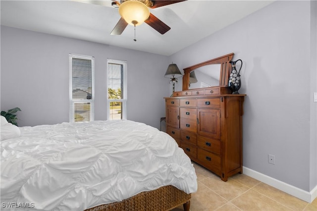 tiled bedroom with ceiling fan