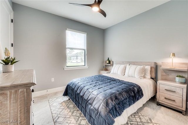 bedroom with light carpet and ceiling fan