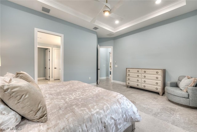 bedroom with crown molding and a raised ceiling