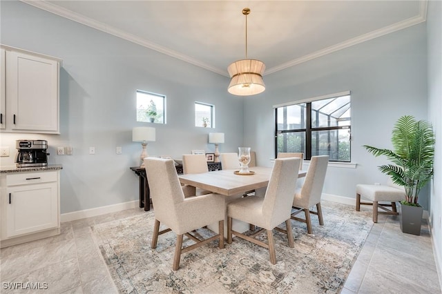 dining area featuring ornamental molding