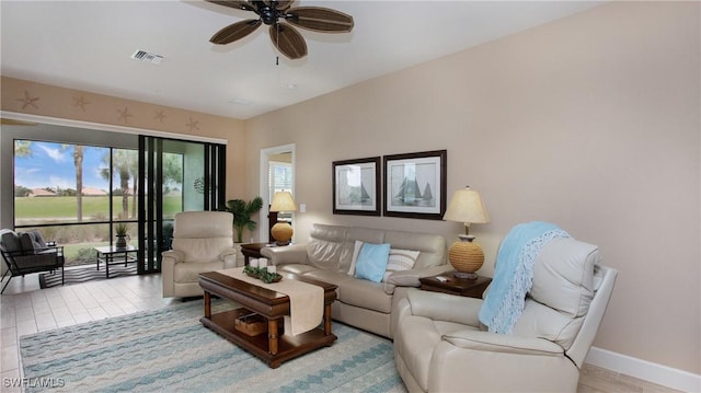 living room with ceiling fan and light hardwood / wood-style floors