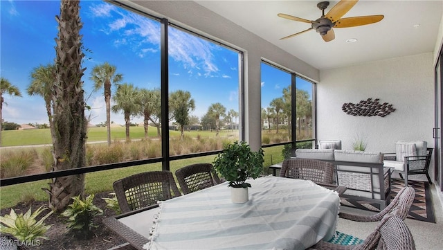 sunroom / solarium with ceiling fan