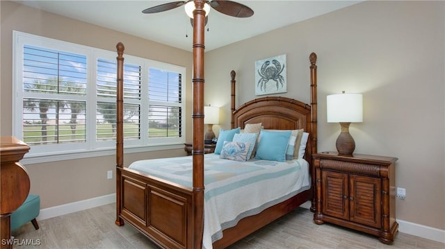 bedroom featuring ceiling fan and light hardwood / wood-style floors