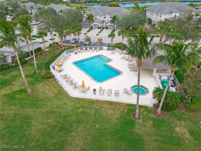 view of swimming pool with a water view and a patio