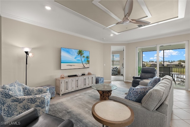 tiled living room with crown molding and ceiling fan