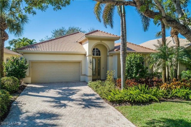 mediterranean / spanish-style house featuring a garage