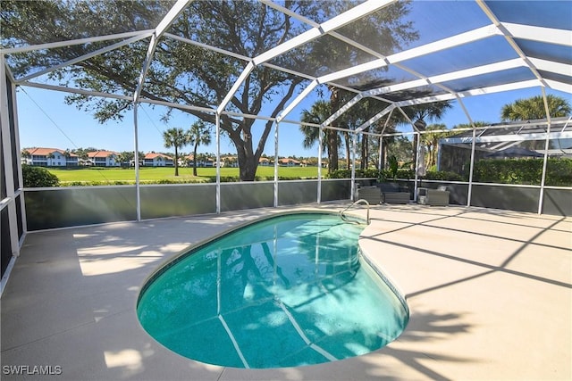 view of pool with a lanai and a patio area