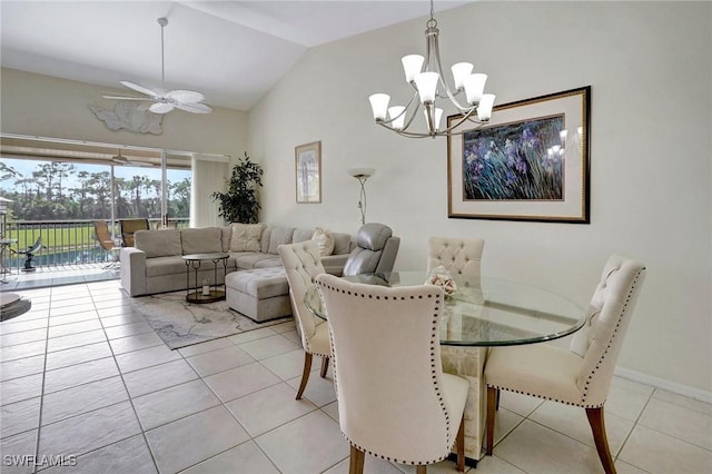 tiled dining space with lofted ceiling and ceiling fan with notable chandelier