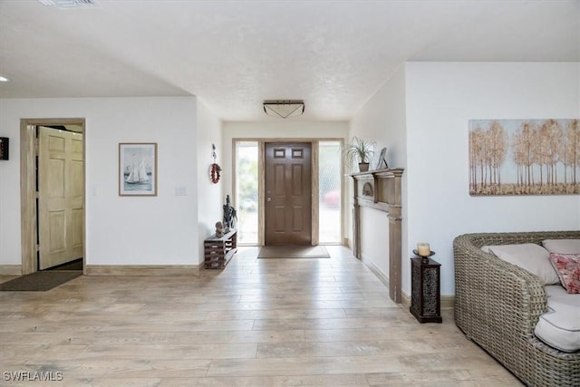 foyer with light wood-type flooring