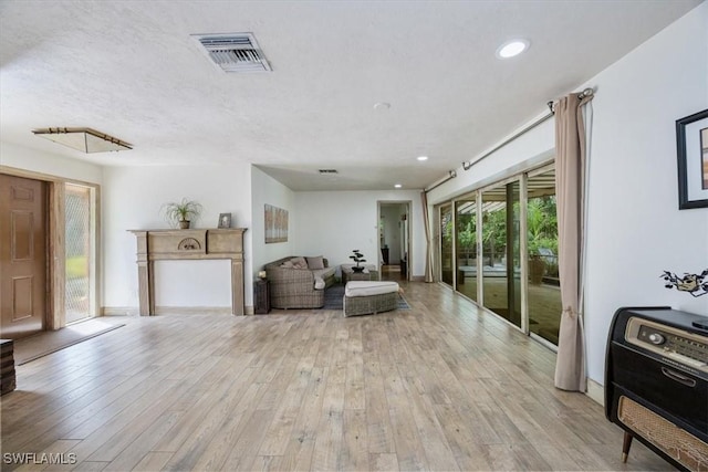 living room with light hardwood / wood-style flooring