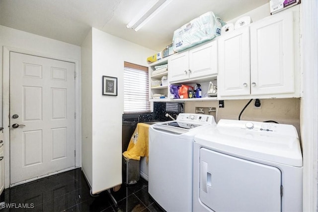 laundry room with cabinets and separate washer and dryer