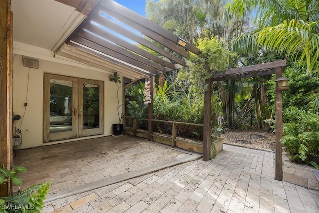 view of patio featuring a pergola and french doors