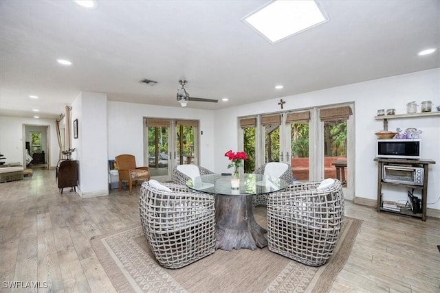 dining area featuring french doors and hardwood / wood-style floors