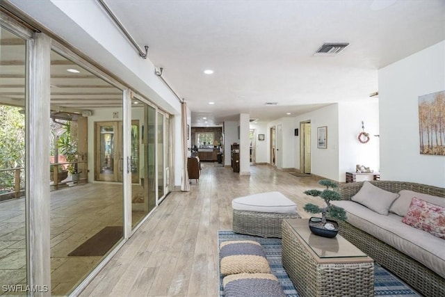 living room with light hardwood / wood-style flooring