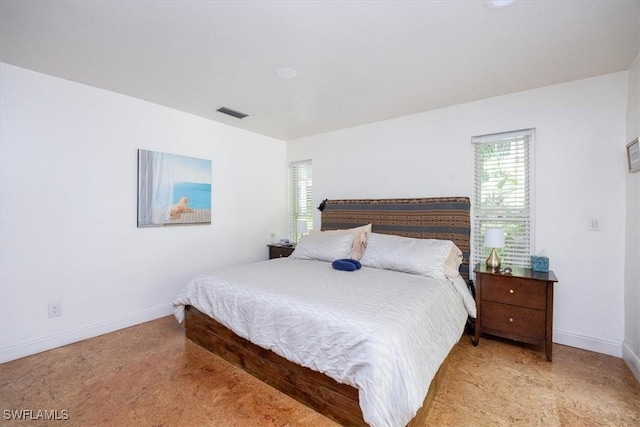 bedroom featuring light carpet