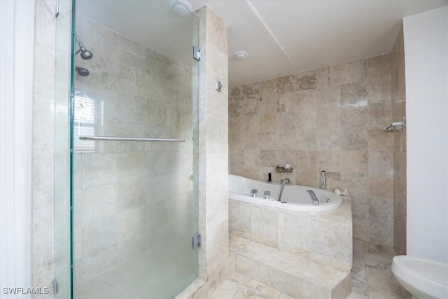 bathroom featuring a bidet, shower with separate bathtub, and tile walls