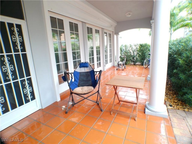 view of patio featuring french doors and covered porch