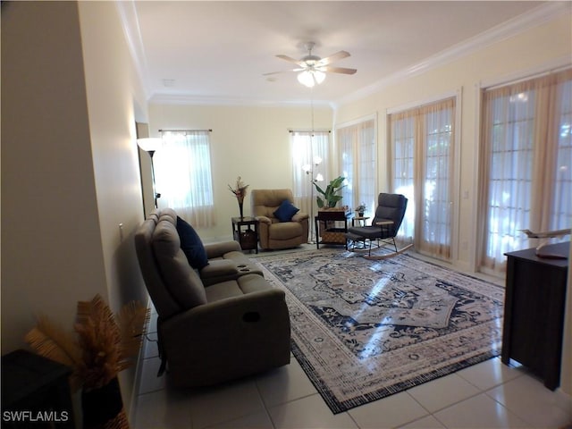 living room featuring ceiling fan, ornamental molding, and light tile patterned floors