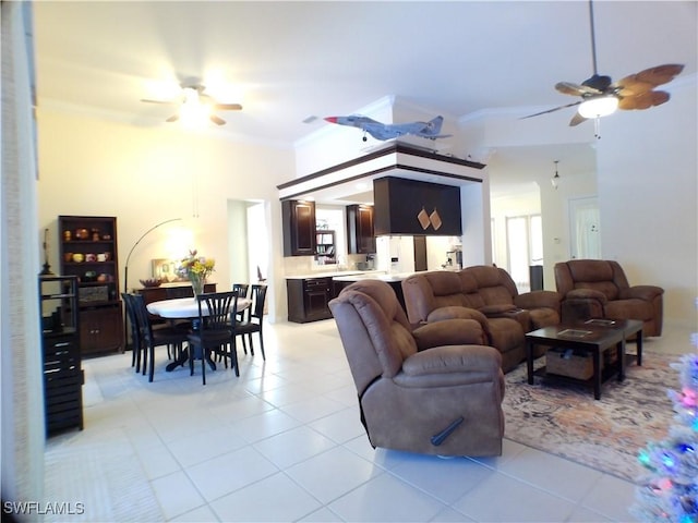 living room featuring crown molding, ceiling fan, and light tile patterned flooring