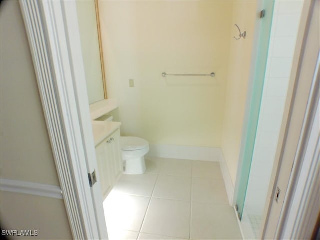 bathroom with tile patterned floors, toilet, and vanity