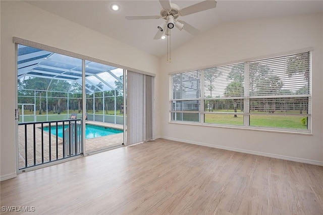 interior space with ceiling fan, light hardwood / wood-style flooring, and lofted ceiling