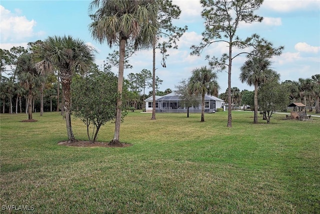 view of yard featuring a lanai